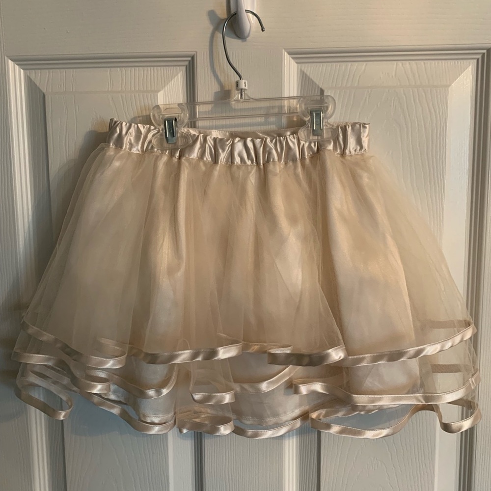 a adorable skirt and a cute white soft shirt.